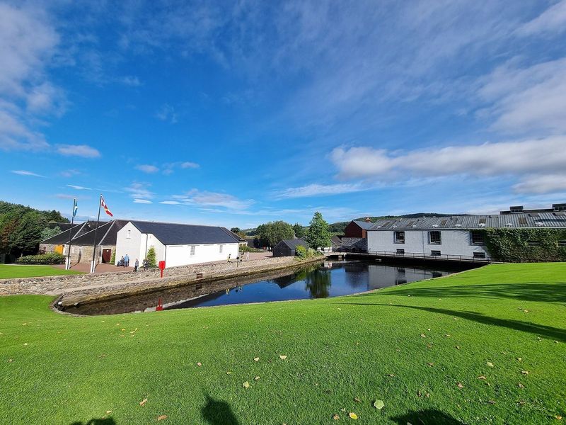 Whisky casks and distillery buildings in Speyside